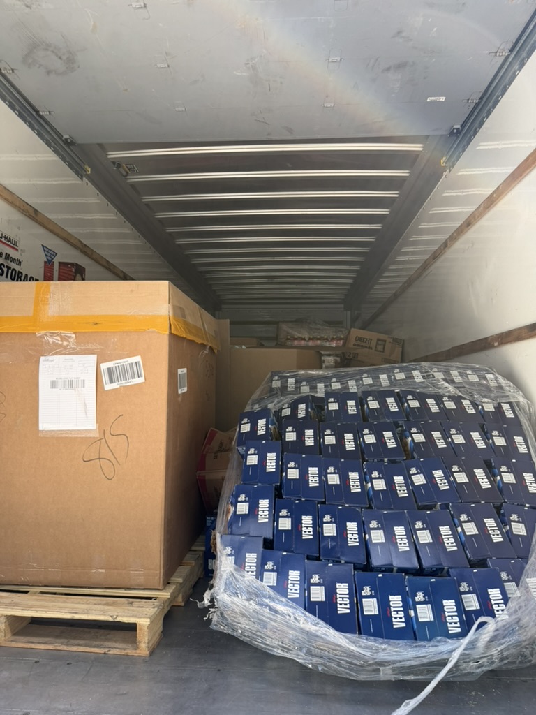 Pallets of boxed food loaded in a truck for distribution